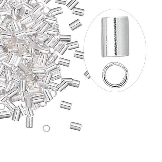 Silver cylindrical bead caps and jump rings shown on a white background, with a pile of the caps on the left and a circular inset on the right showing a close-up of one cap and one ring.
