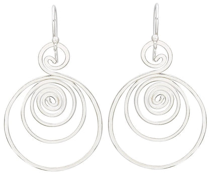 A pair of silver drop earrings with a unique spiral design, featuring concentric open circular spirals hanging from simple silver fishhook wires, shown against a plain white background.