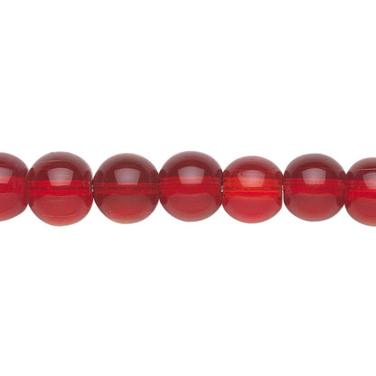 Red glass beads on a white background