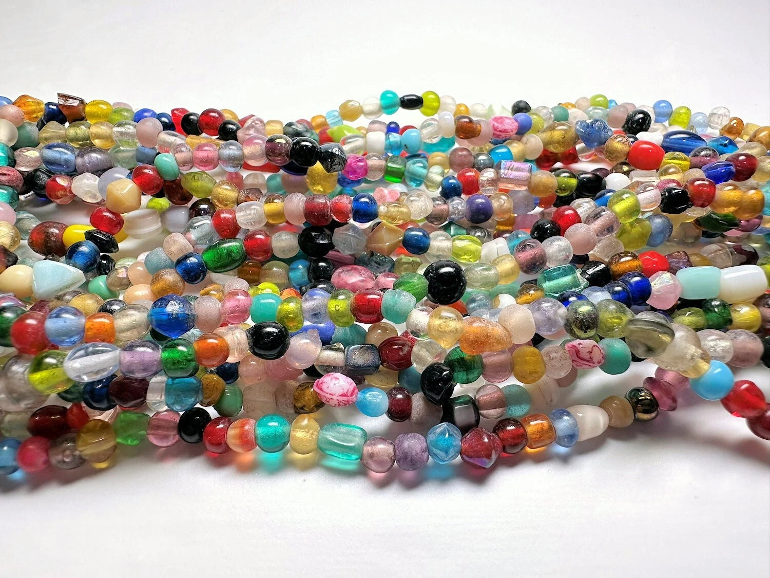 Multicolored beaded strands on a white background
