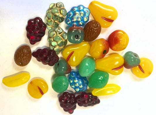 Assorted colorful glass beads on a white background