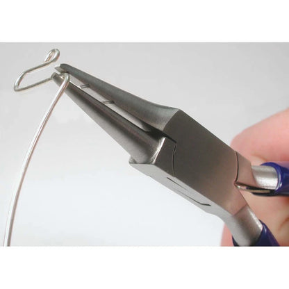 Metal pliers holding a wire against a white background