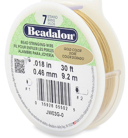 A spool of Beadalon gold-colored bead stringing wire, 0.18 in (0.