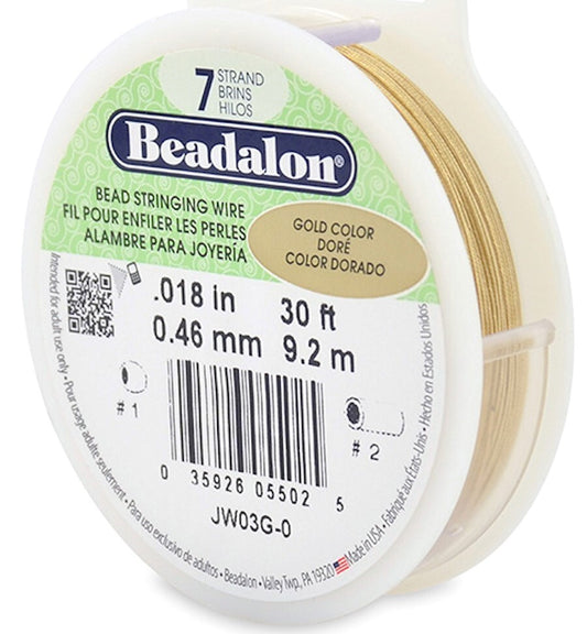 A spool of Beadalon gold-colored bead stringing wire, 0.18 in (0.